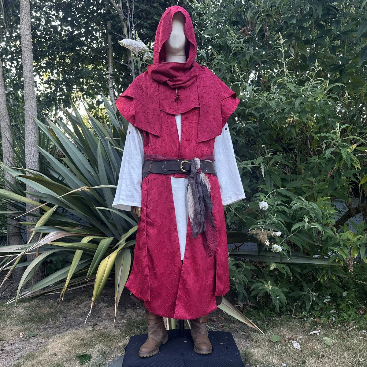 Red panelled waistcoat with the hood collar stood up at the neck, front view. Shirt and belt sold separately.