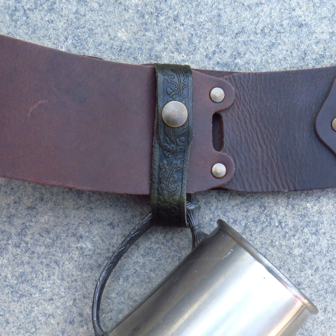 Close view of the leather tankard loop fastened around a belt