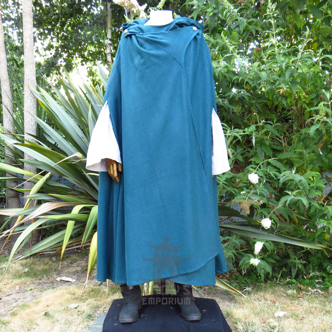 Teal hooded cloak worn open over a white tunic, tunic sold separately