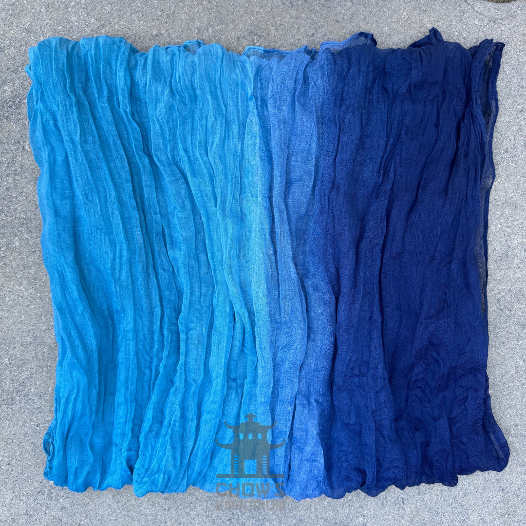 Folded Tide pirate sash showing sky blue to navy gradient