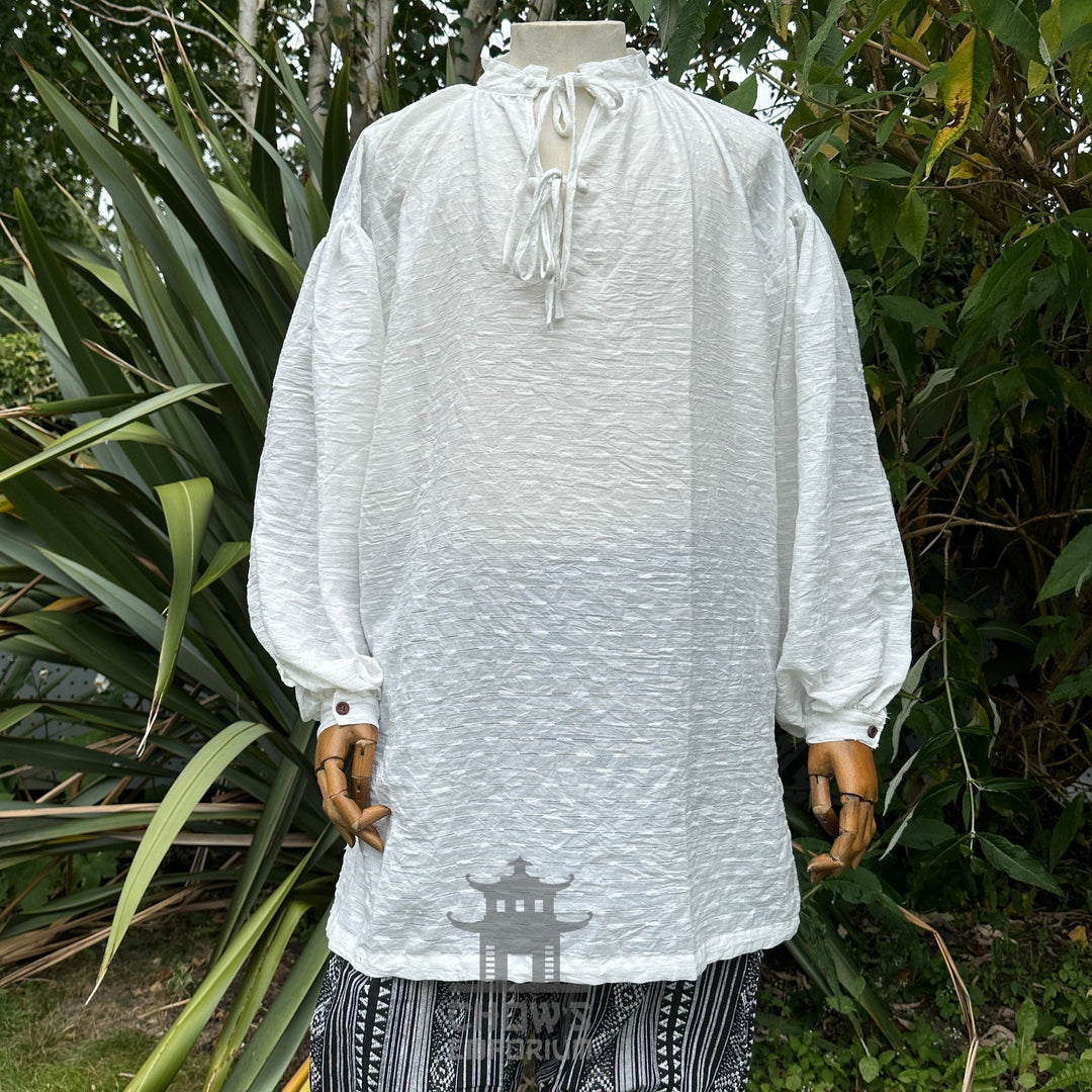 Textured white cotton-linen shirt with lace-up neckline, front view, part of the Cerulean Sorcerer outfit set
