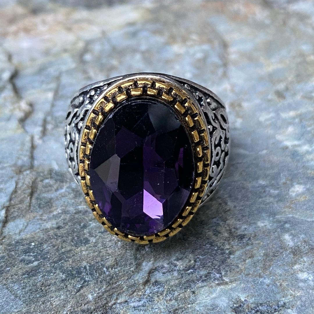 Ornate deep purple gemstone ring with filigree band for medieval LARP.
