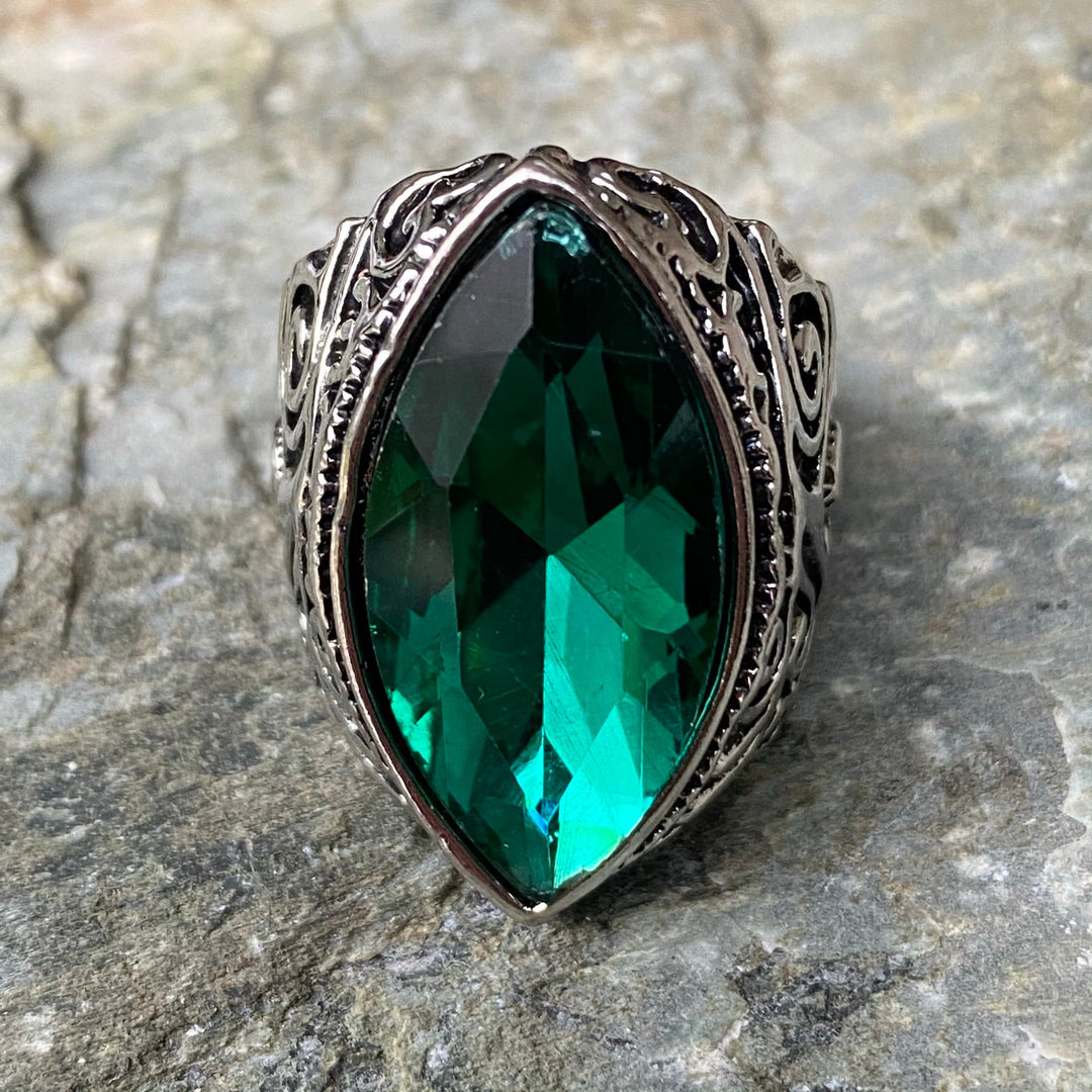 Silver ring with green oval gem, medieval swirl design for LARP events.