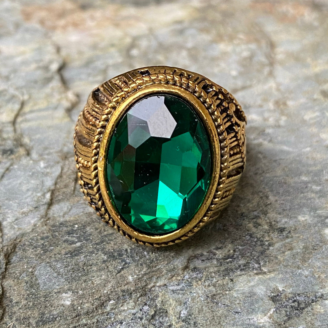 Rustic gold ring with emerald green gemstone for medieval LARP events.