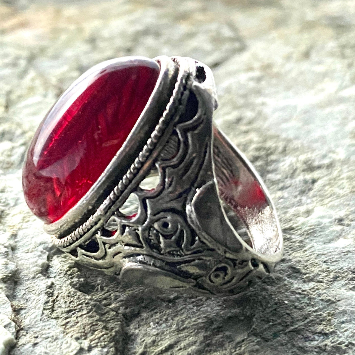 Engraved silver ring with red gem on stone for LARP.