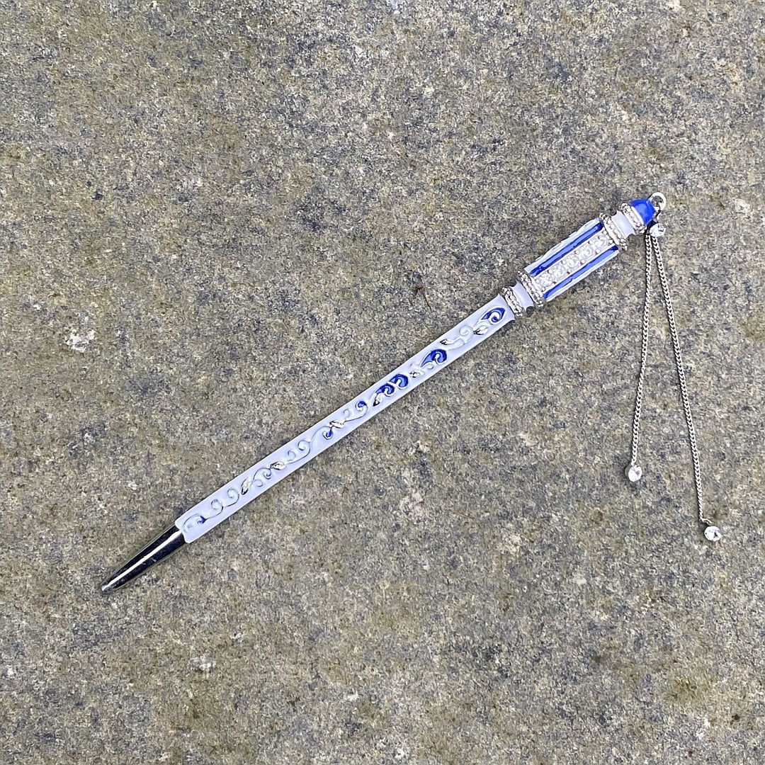 Medieval LARP hairpin with ornate blue swirls and chain detailing.