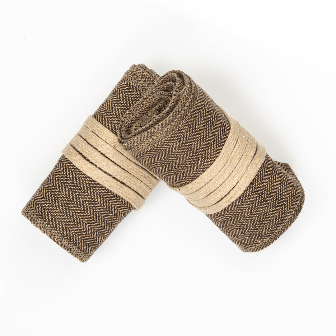 Brown herringbone medieval leg wraps with beige bands for LARP.
