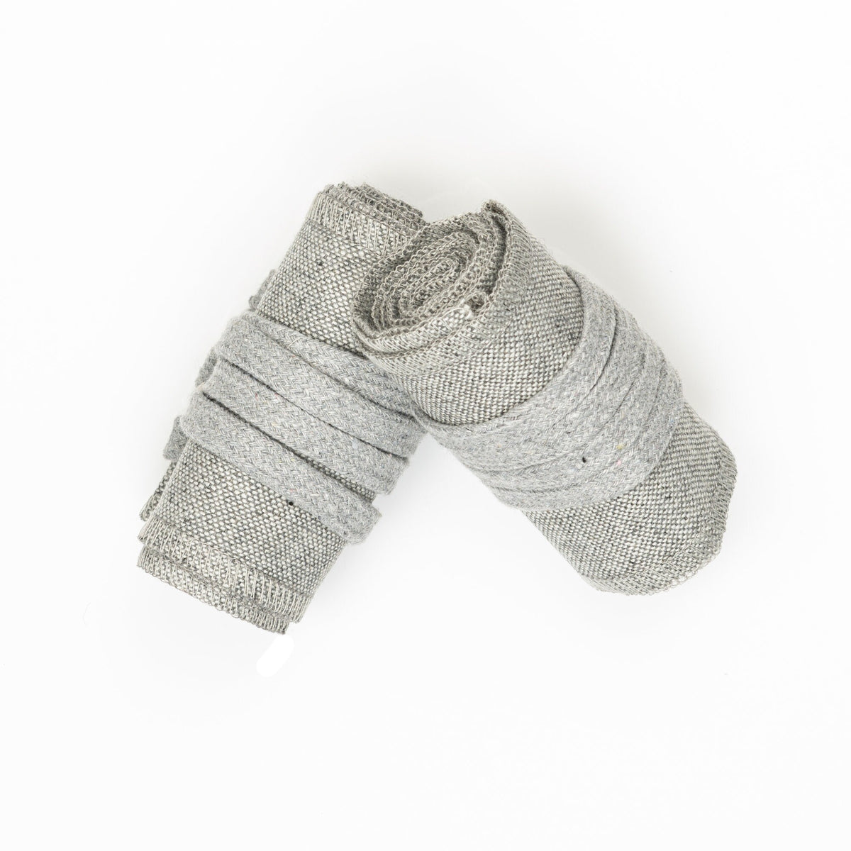 Rolled light grey wool medieval arm wraps for LARP, top view.
