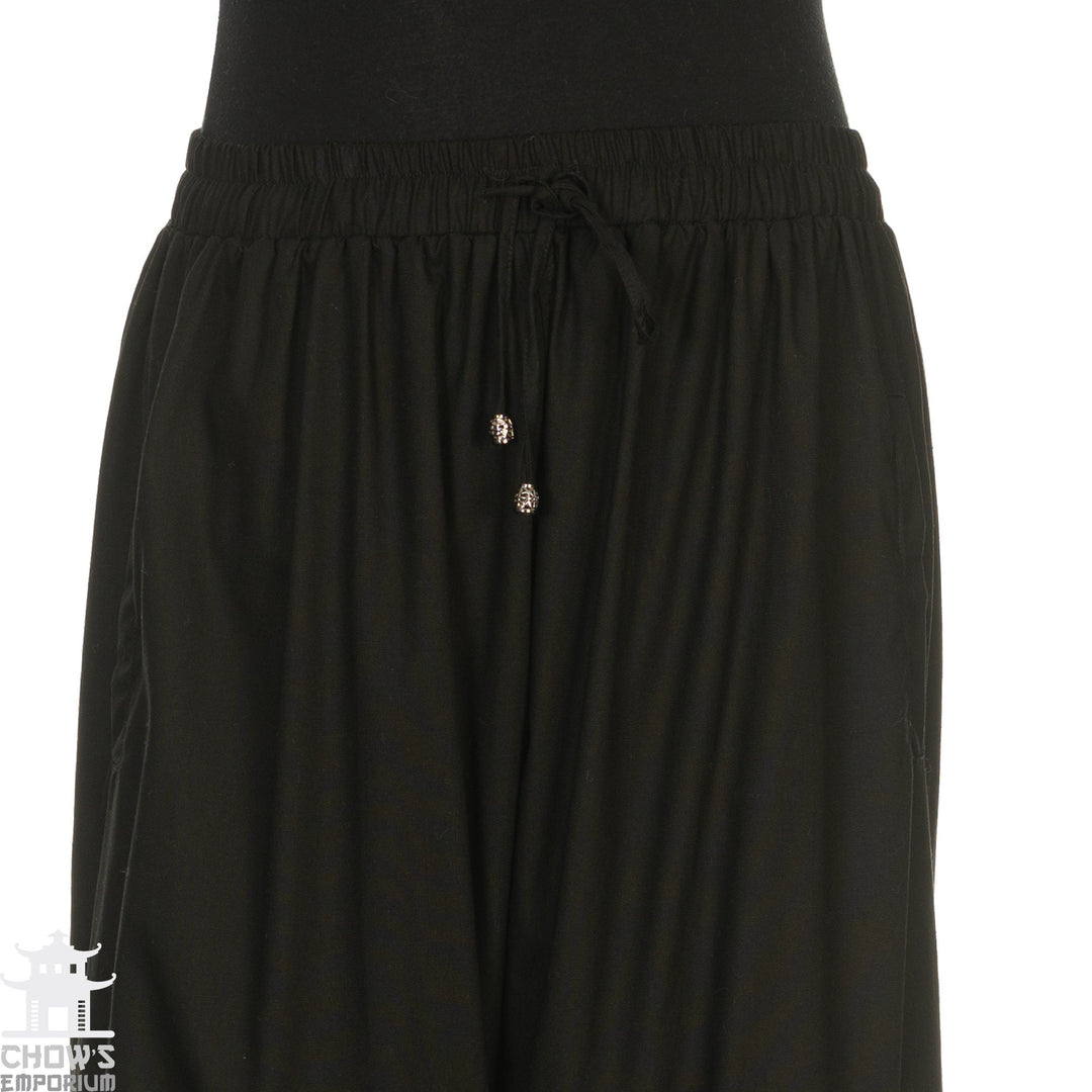 Midsection view of black medieval LARP pants with braided drawstring.