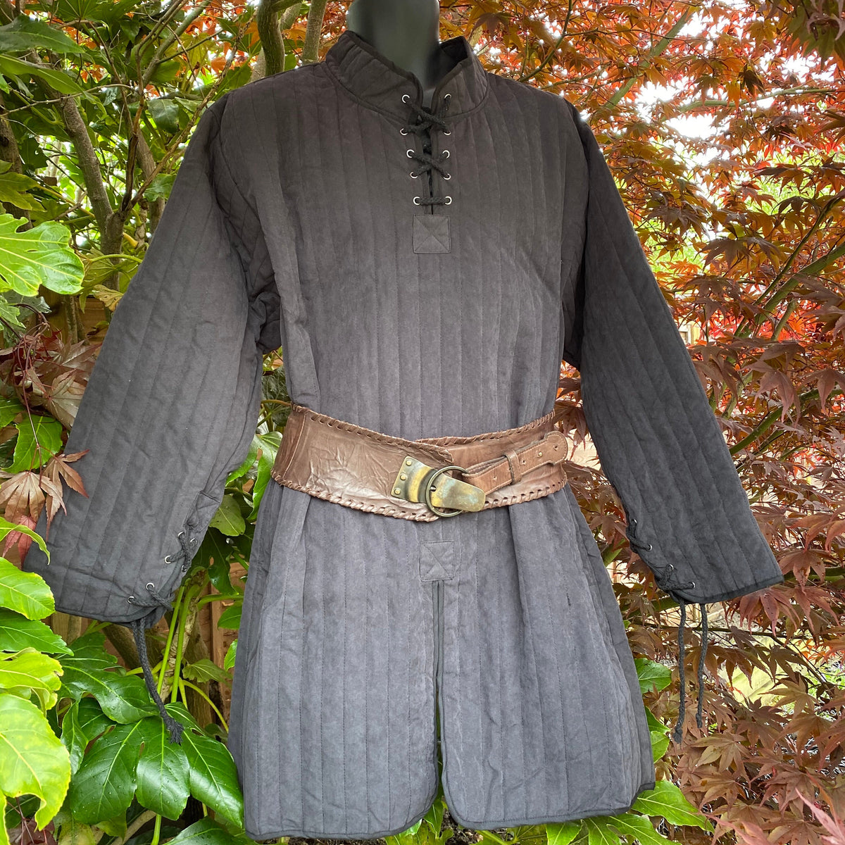 Black LARP gambeson with brown belt, laced collar, and.