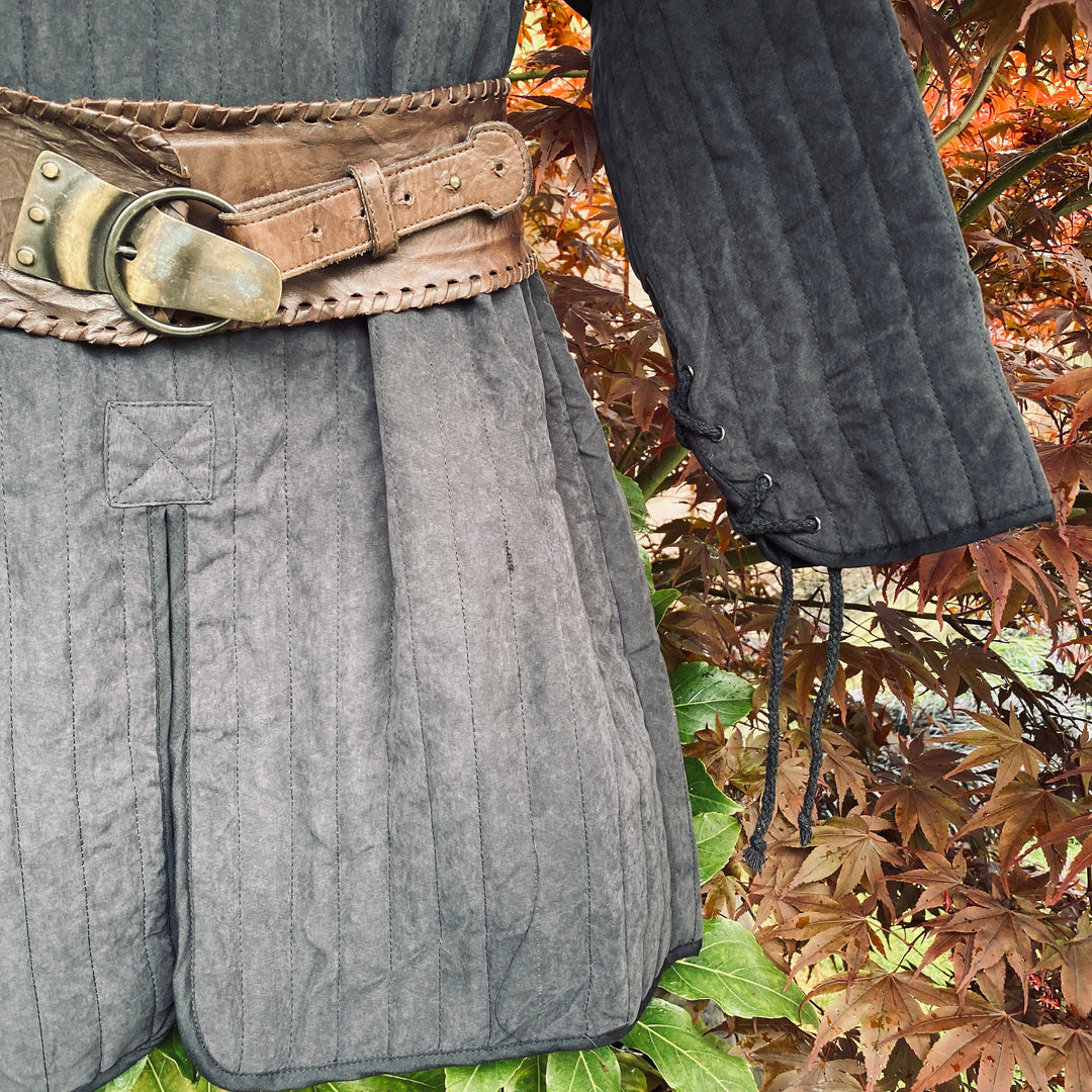 LARP gambeson close-up with brown belt and stitched sleeves.