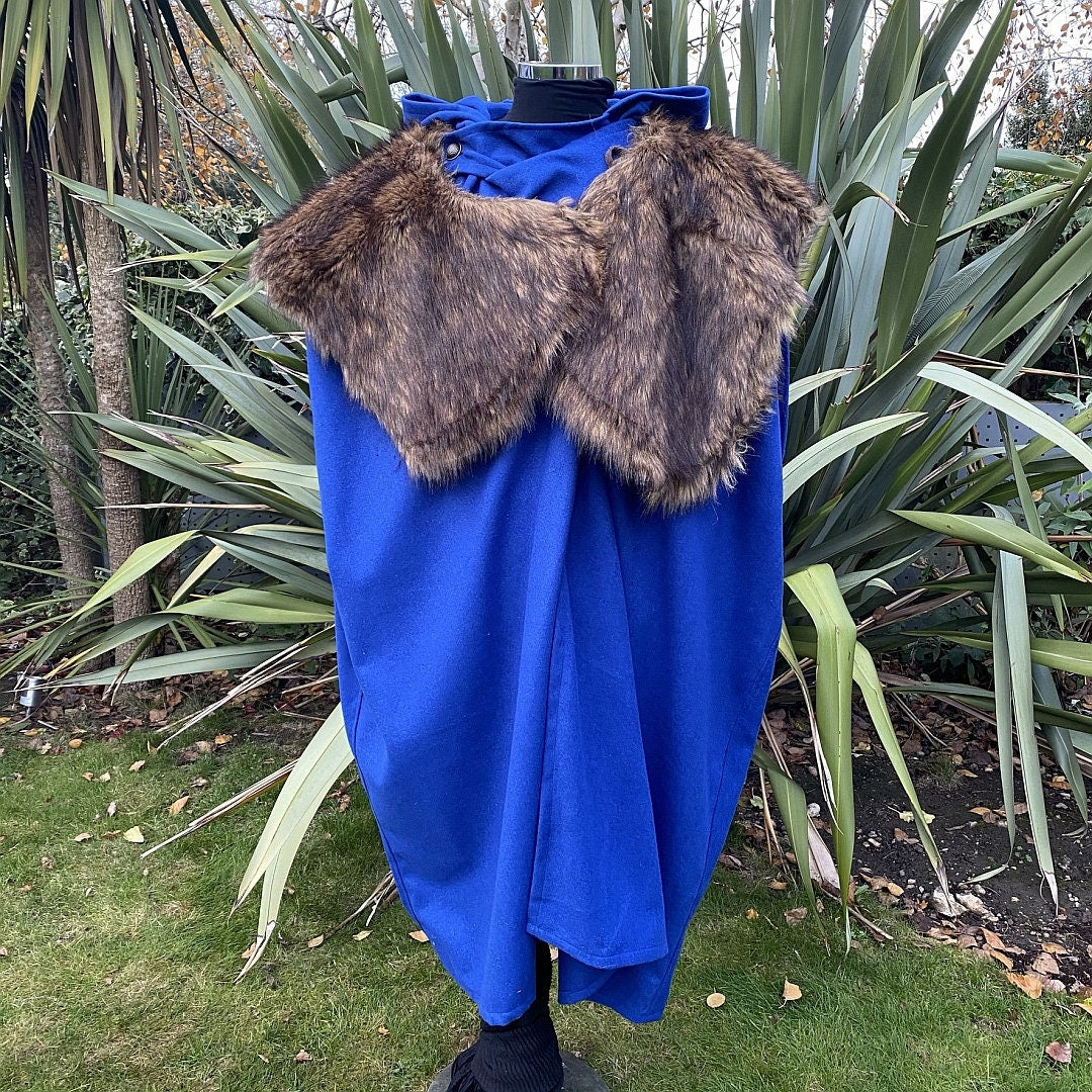 Royal blue medieval cloak with fur mantle displayed.