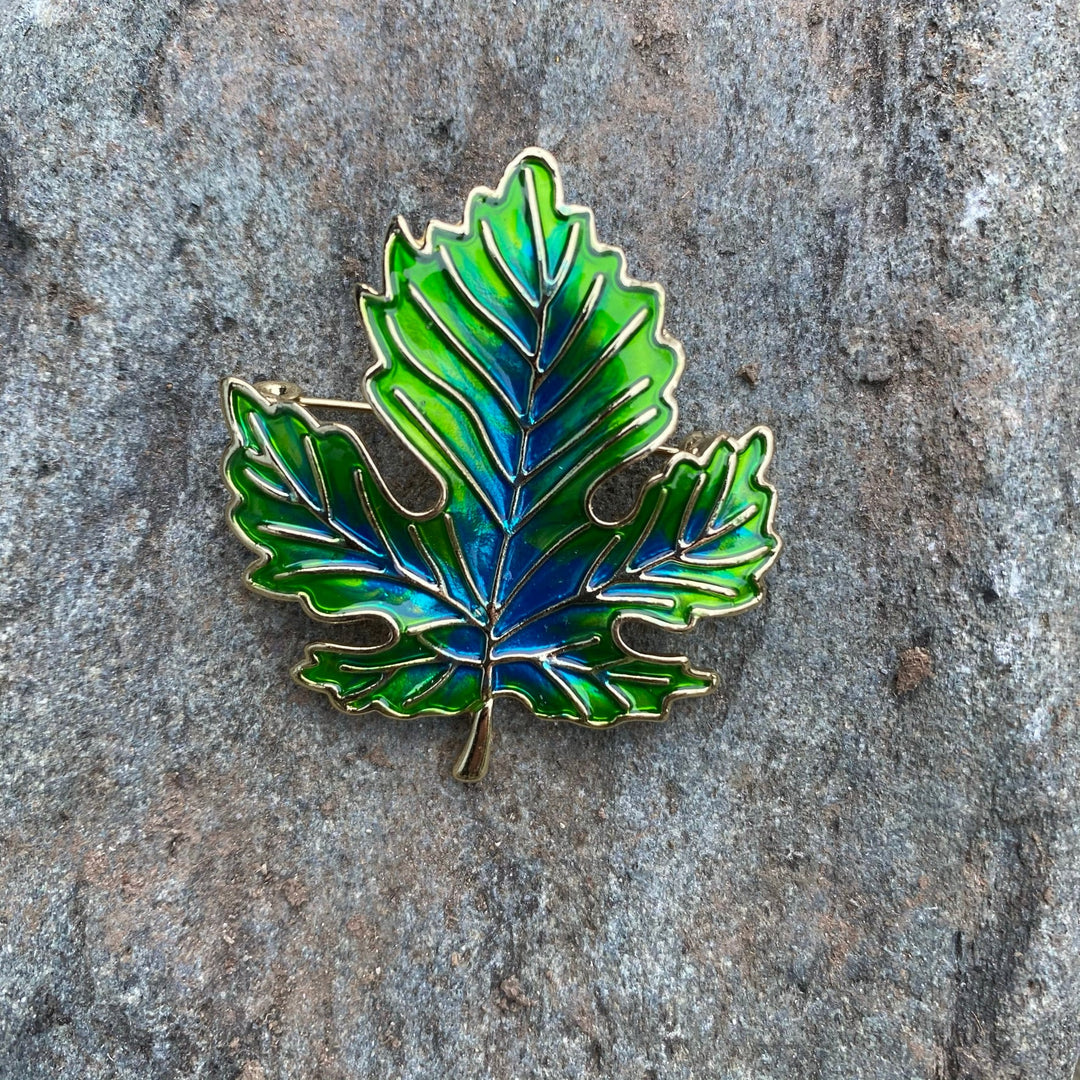 Green enamel elven leaf pin on stone, accent for medieval LARP costumes.