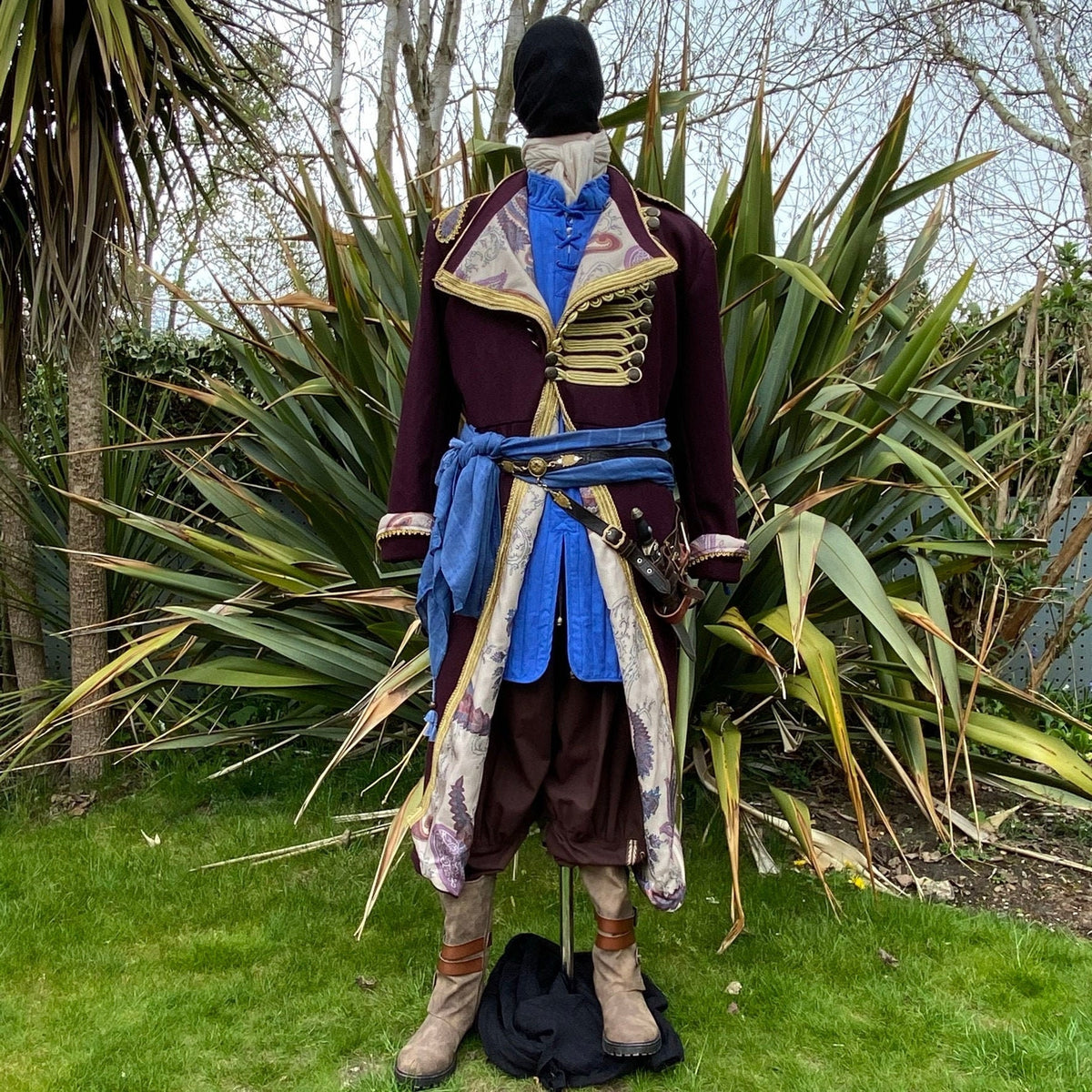 Front view of Pirate King LARP attire with blue sash detailing.