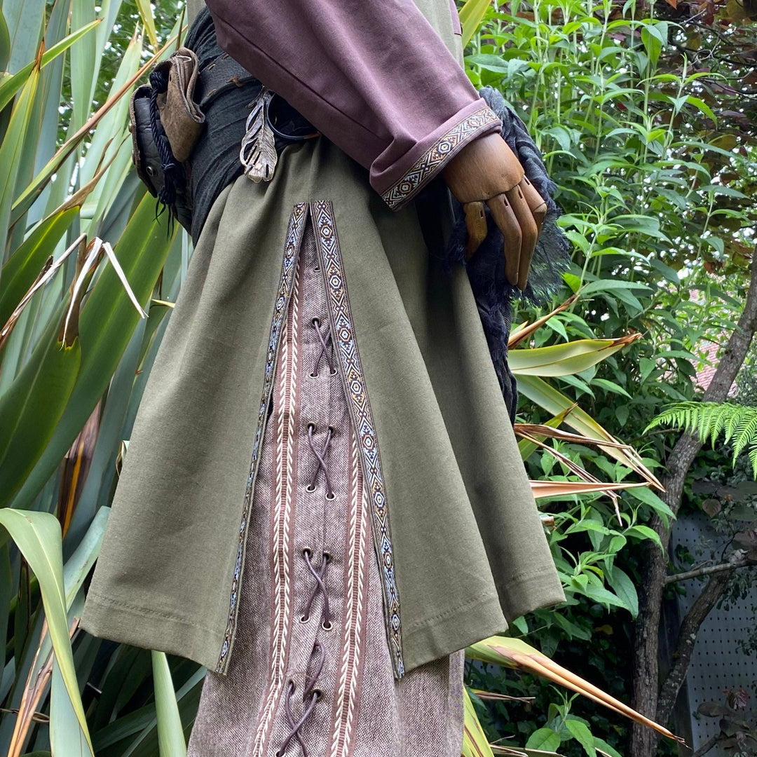 Side view of medieval tunic detailing with sash, green and brown LARP attire.