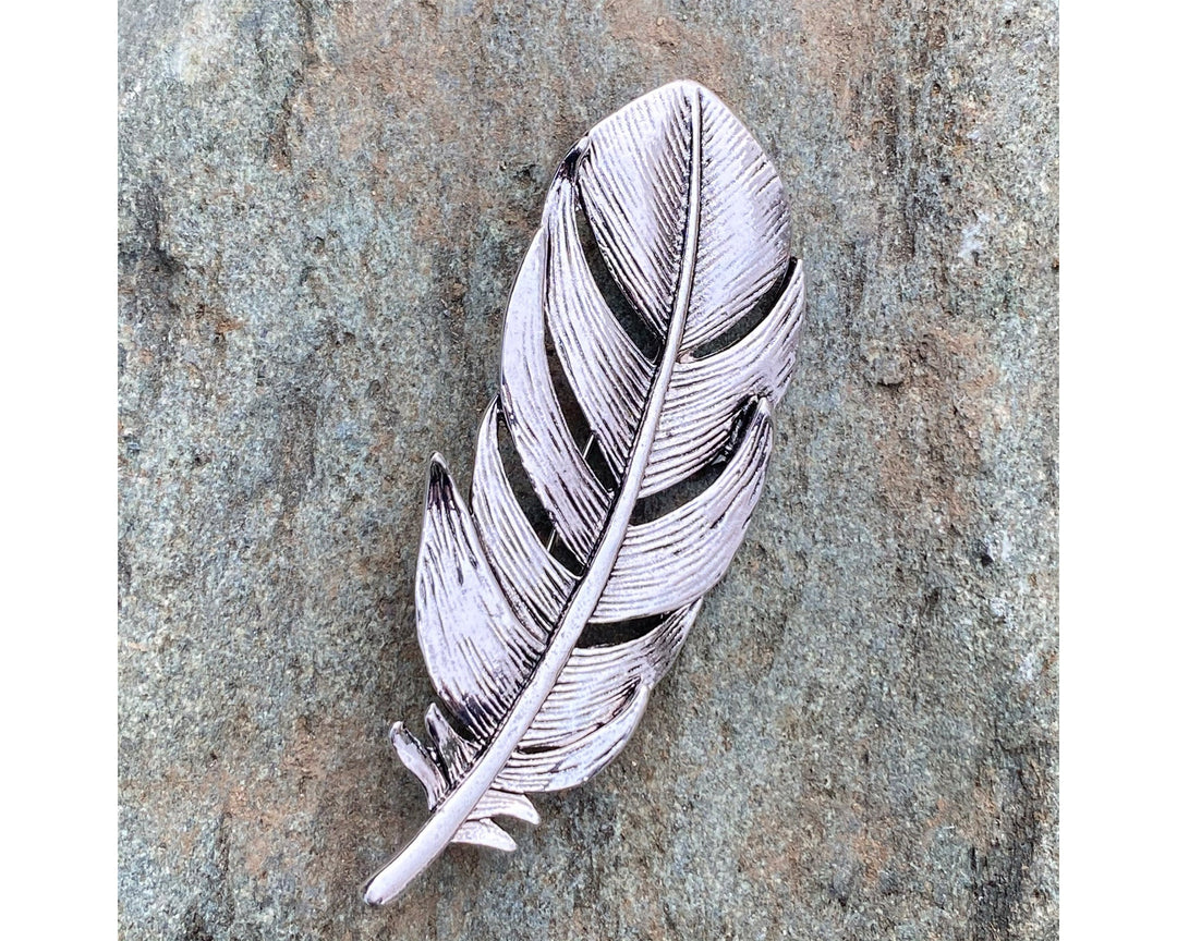 Silver feather brooch on stone, detailed veins for LARP.