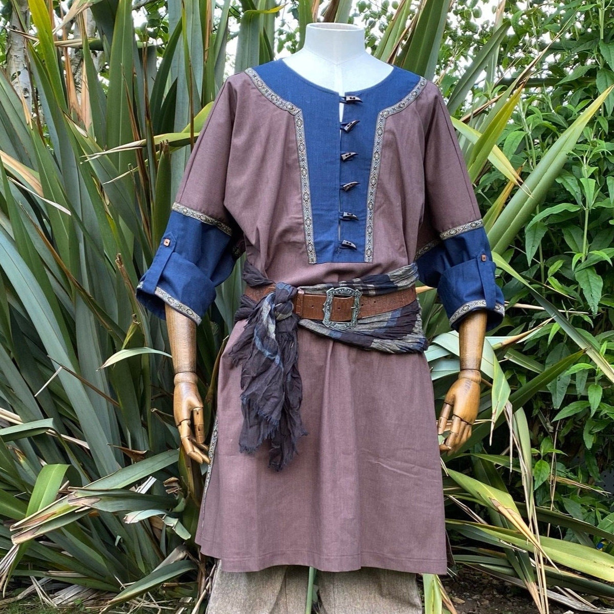 Blue-accented tunic with belt and scarf, worn on mannequin, medieval LARP style.