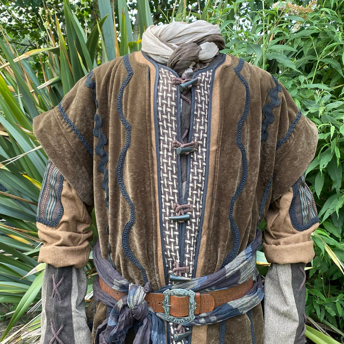 Medieval LARP costume with suede jacket close-up and belt detail.