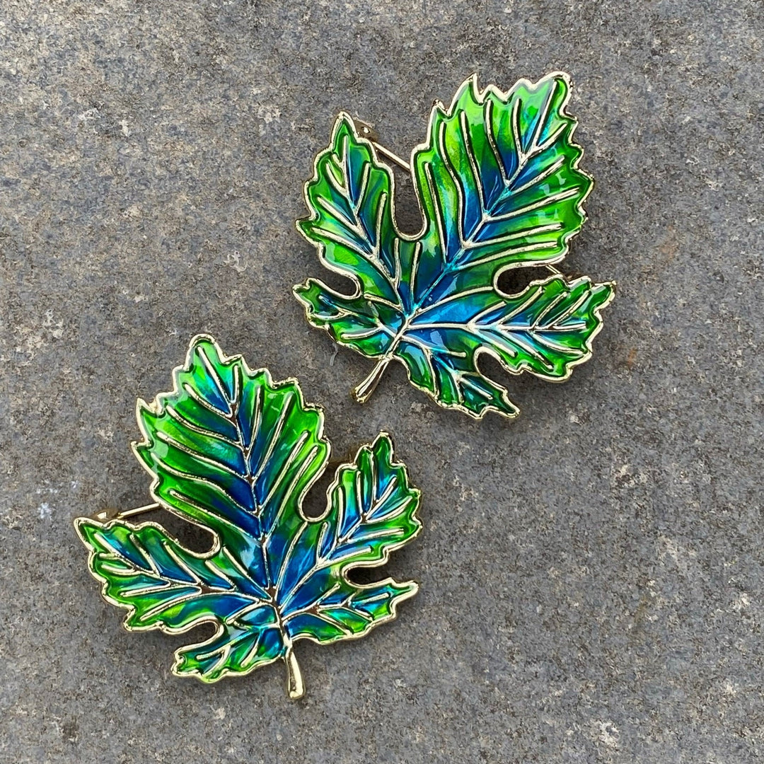 Two green and blue elven leaf brooches on stone for LARP.