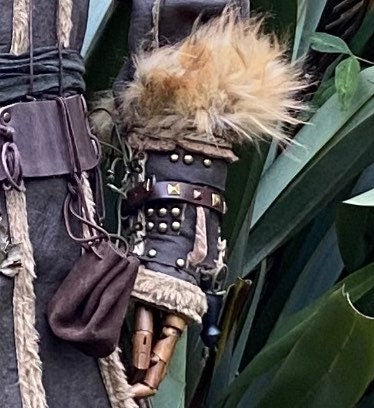 LARP medieval vambrace with studs and fur, close-up side view.