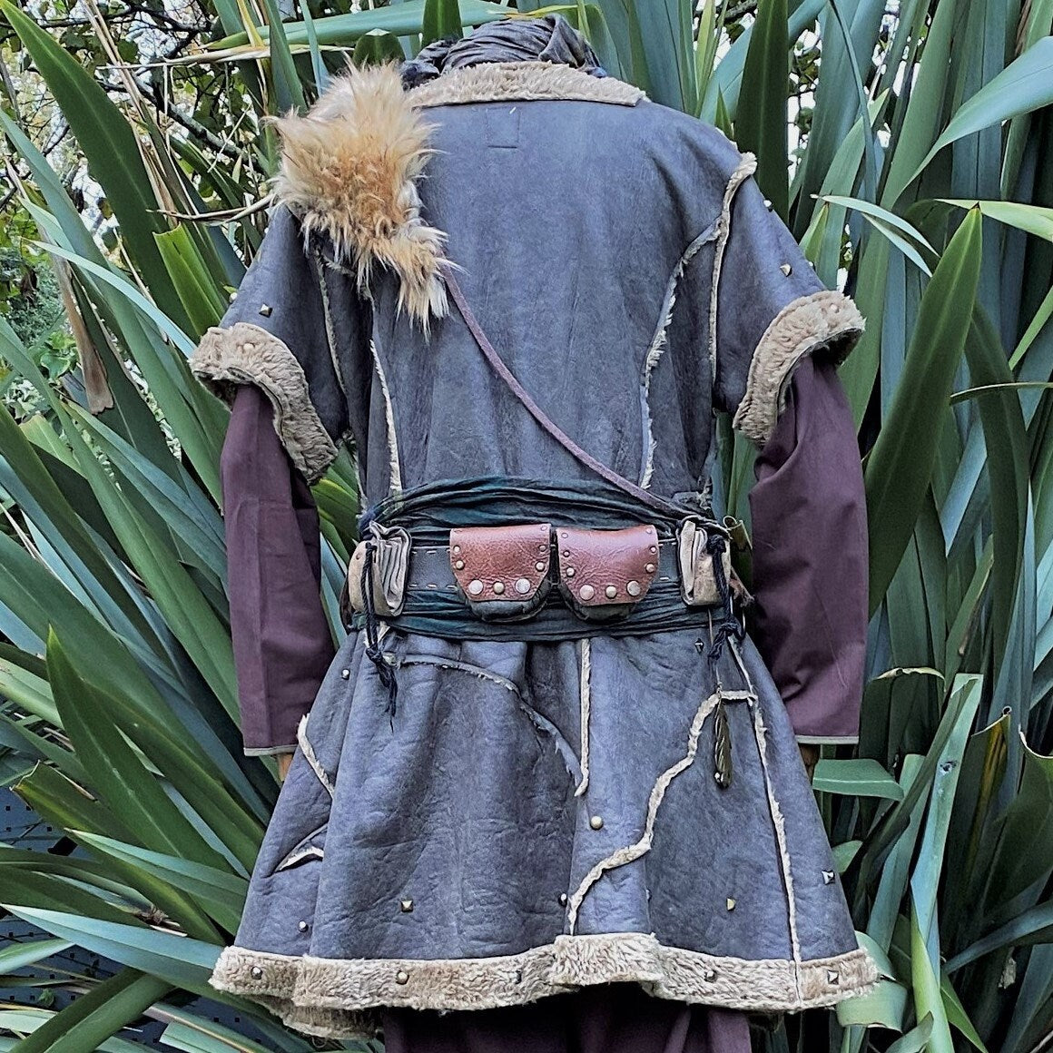 studded green faux leather medieval tunic.