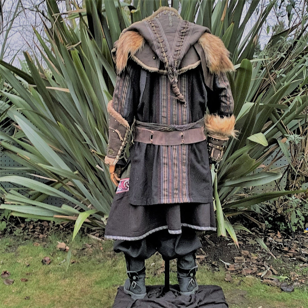 Back view of medieval LARP outfit with fur trim and leather hood.
