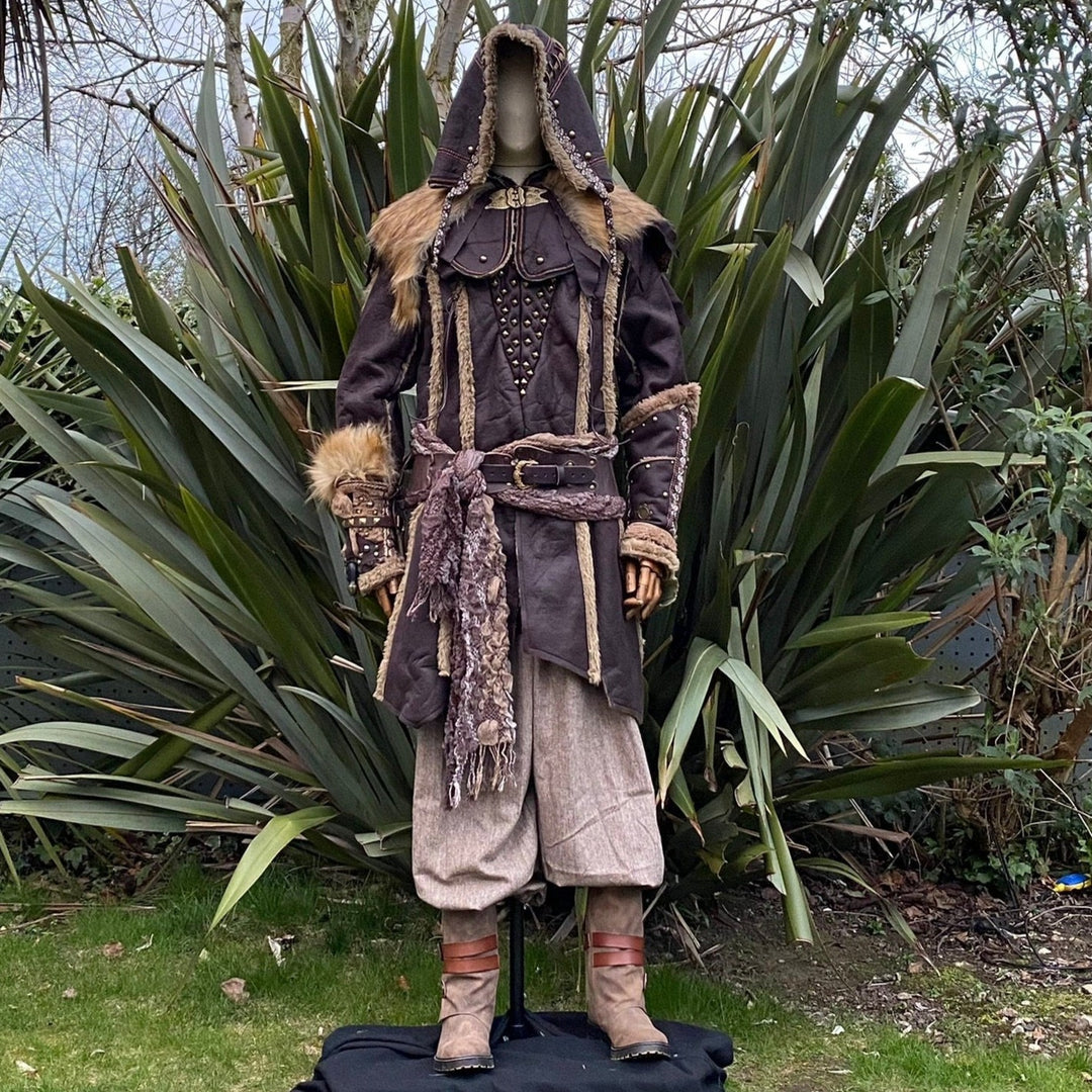Mannequin in medieval LARP attire with fur-trimmed jacket and detailed vambraces.