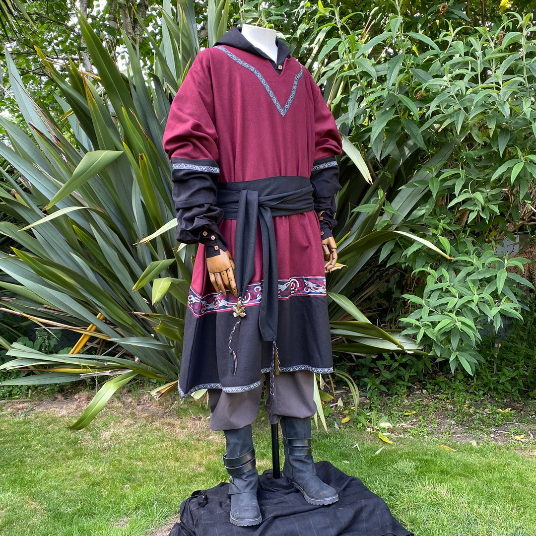 Medieval LARP attire with red tunic, black sash.