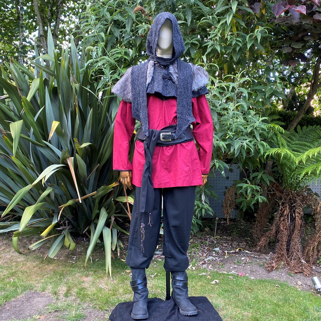 Medieval LARP attire mannequin in garden with red tunic and grey mantle.