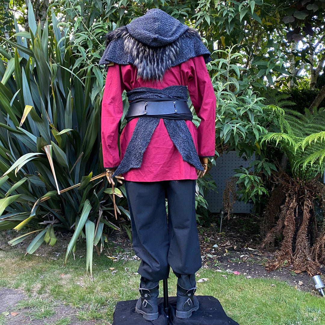 Back view: LARP red shirt with faux fur mantle, black pants.