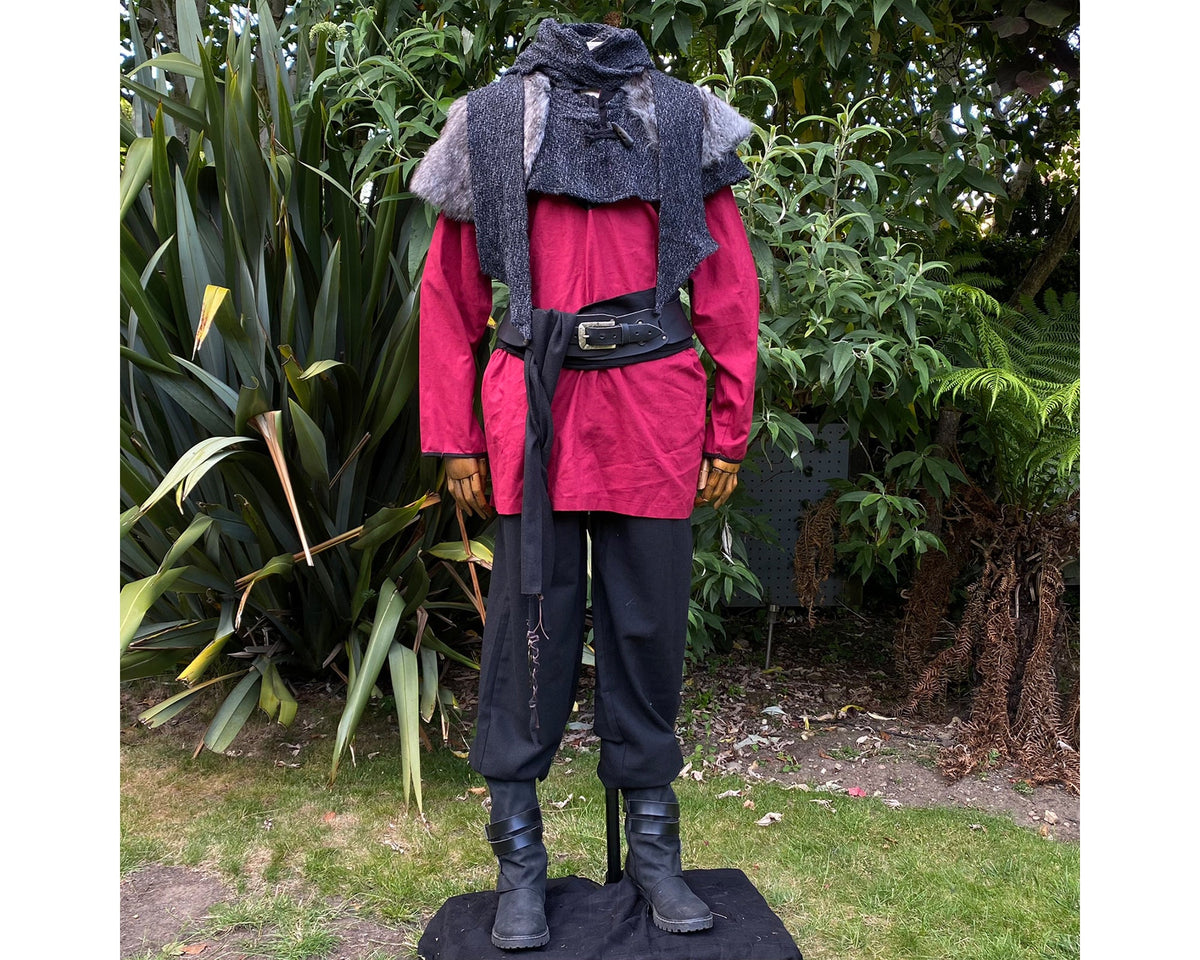 Mannequin in LARP medieval outfit with red shirt, grey mantle, belted waist.