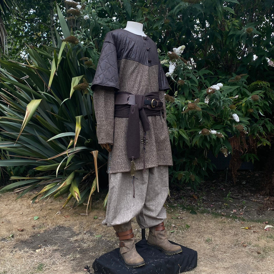 LARP costume with tunic, pants, sash; side view.