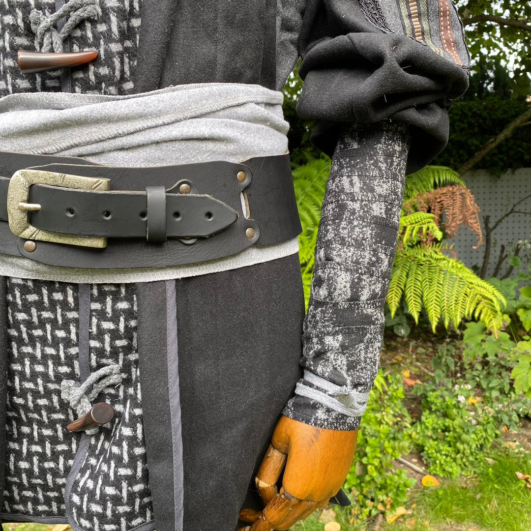 LARP medieval wool arm wraps, close-up with leather belt and ornate textures.