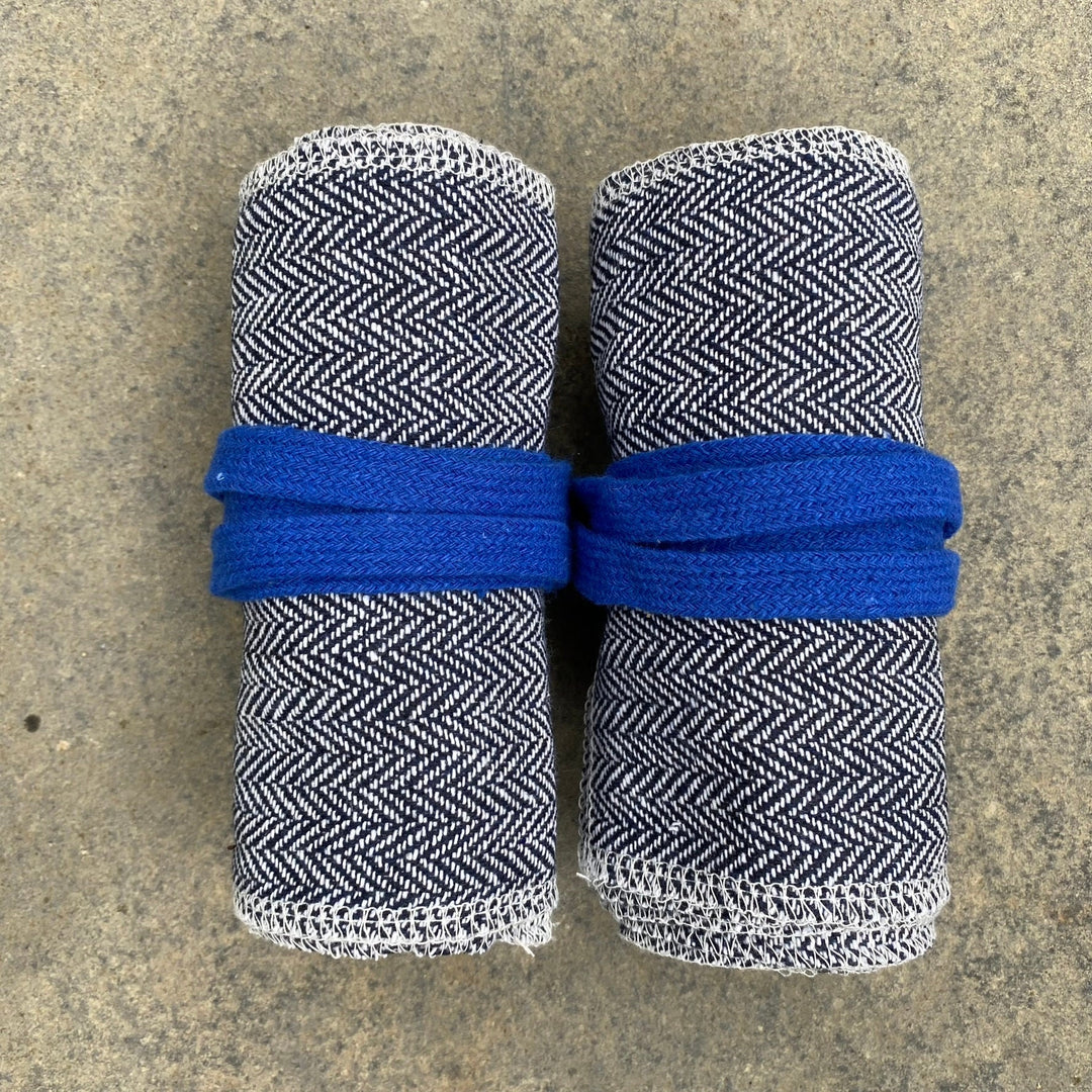 Rolled wool leg wraps in herringbone pattern; blue bands for medieval LARP use.