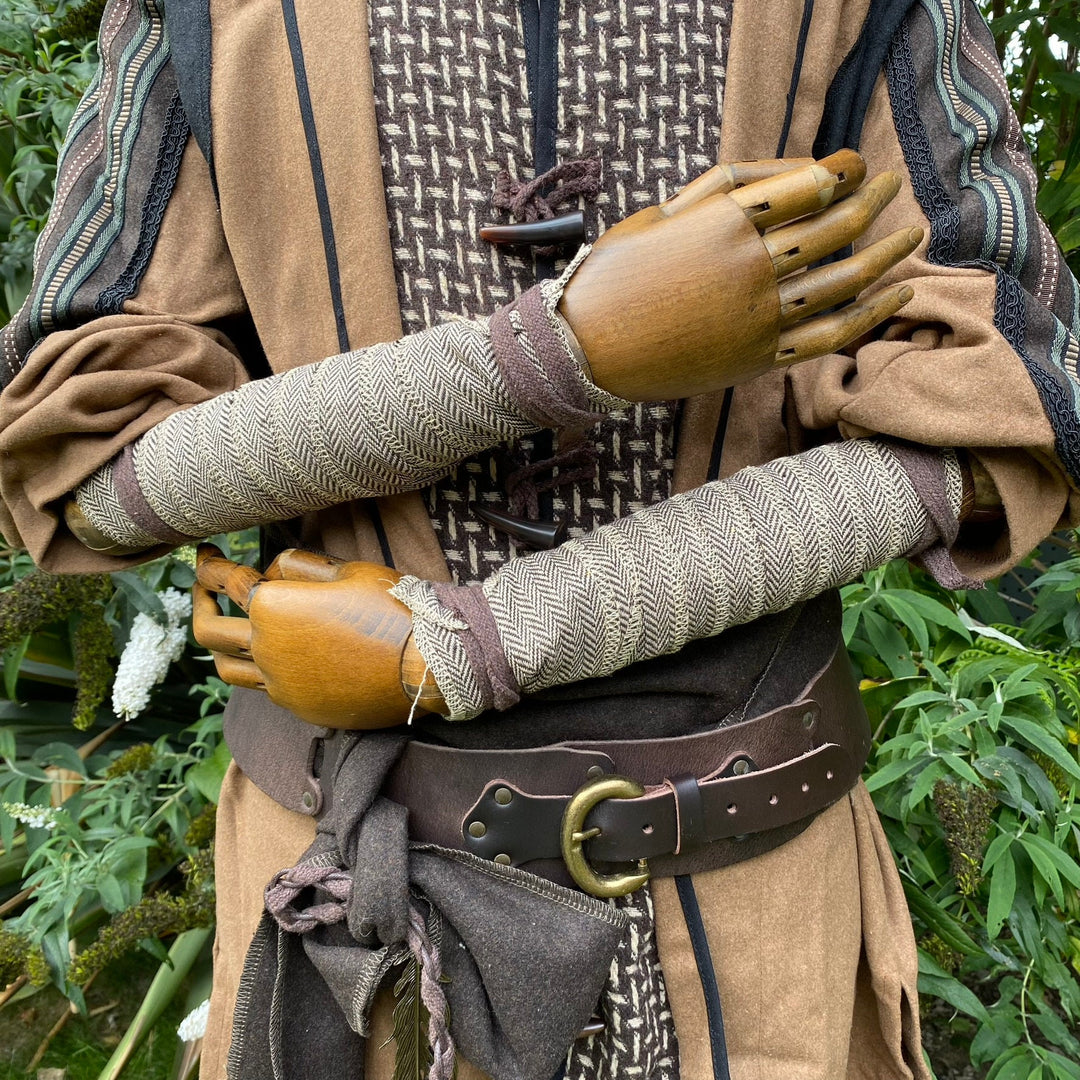 LARP outfit with crossed arms in wool herringbone wraps, detailed angle.