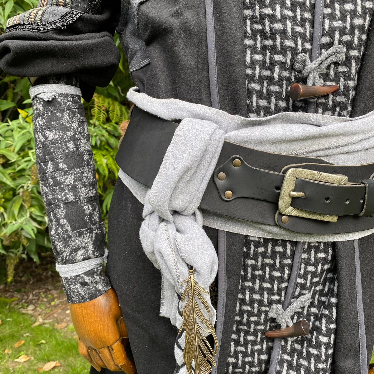 Grey black wool arm wraps, medieval LARP style with ornate fabric details.