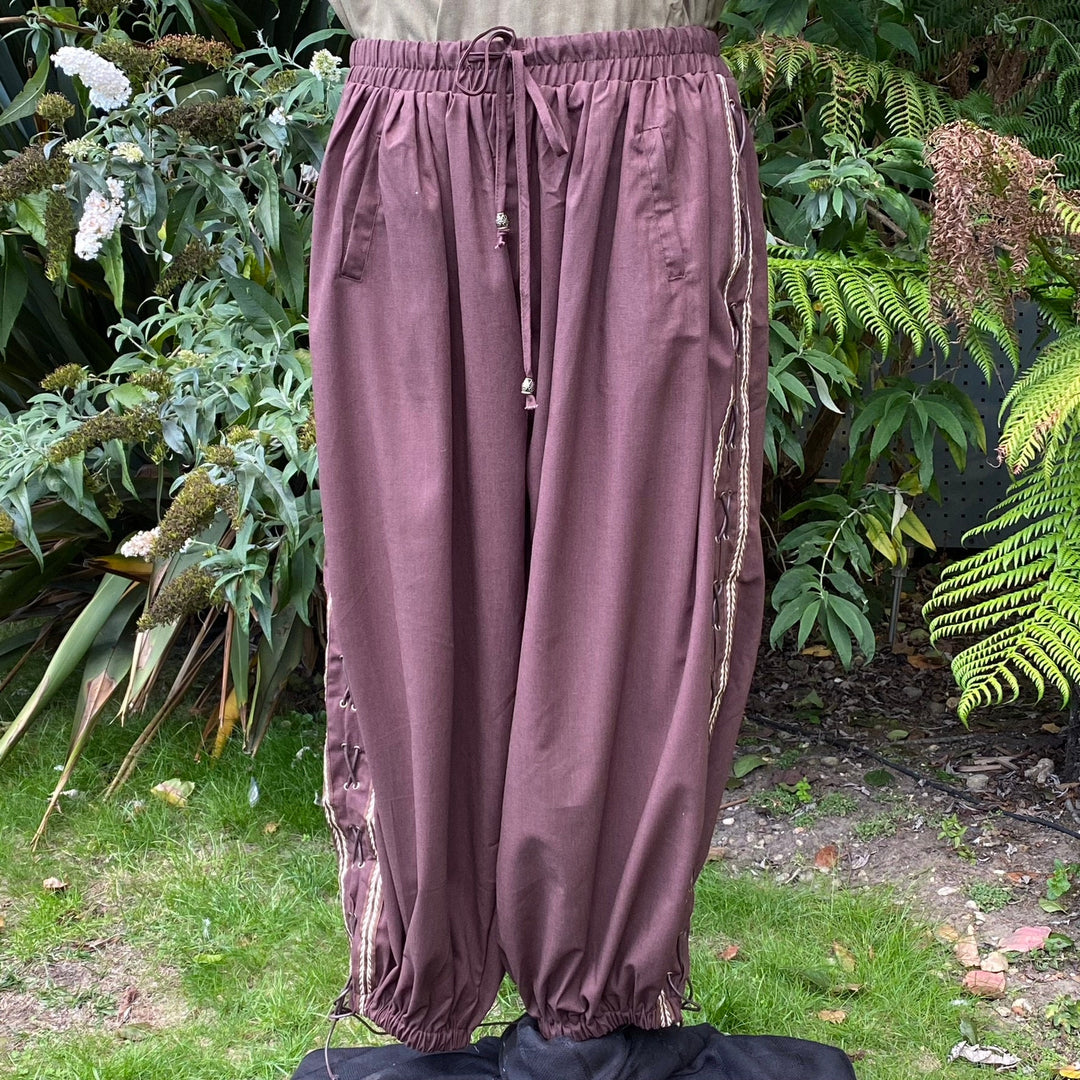Loose brown LARP pants with side braid detail.