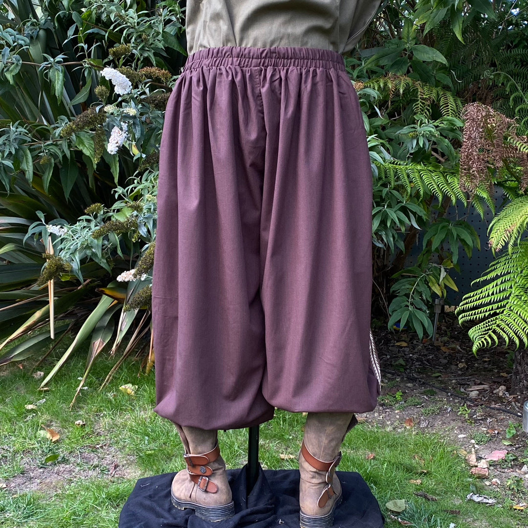 Back view of brown medieval LARP trousers, elastic waist.