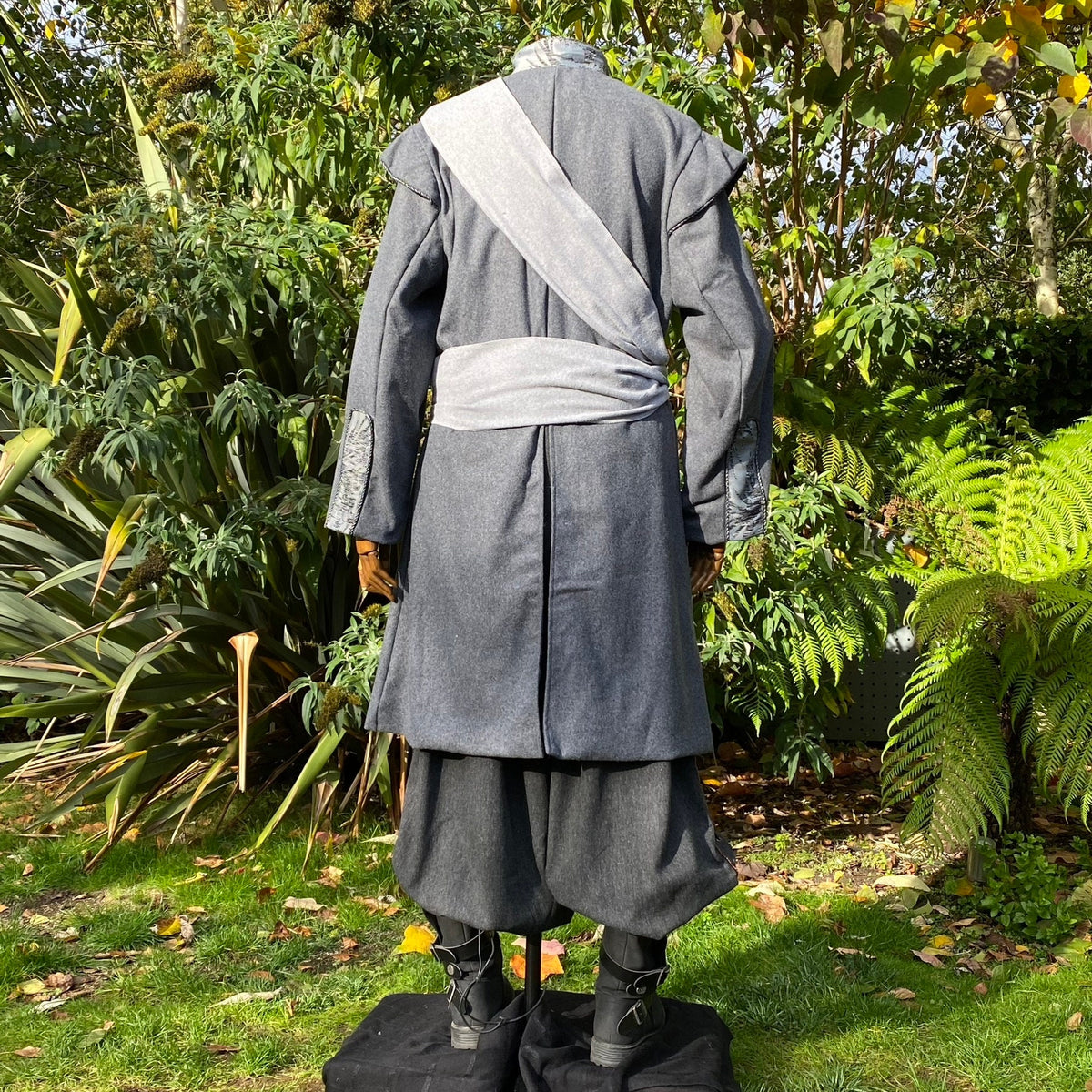 Back view of medieval LARP coat with grey sash.