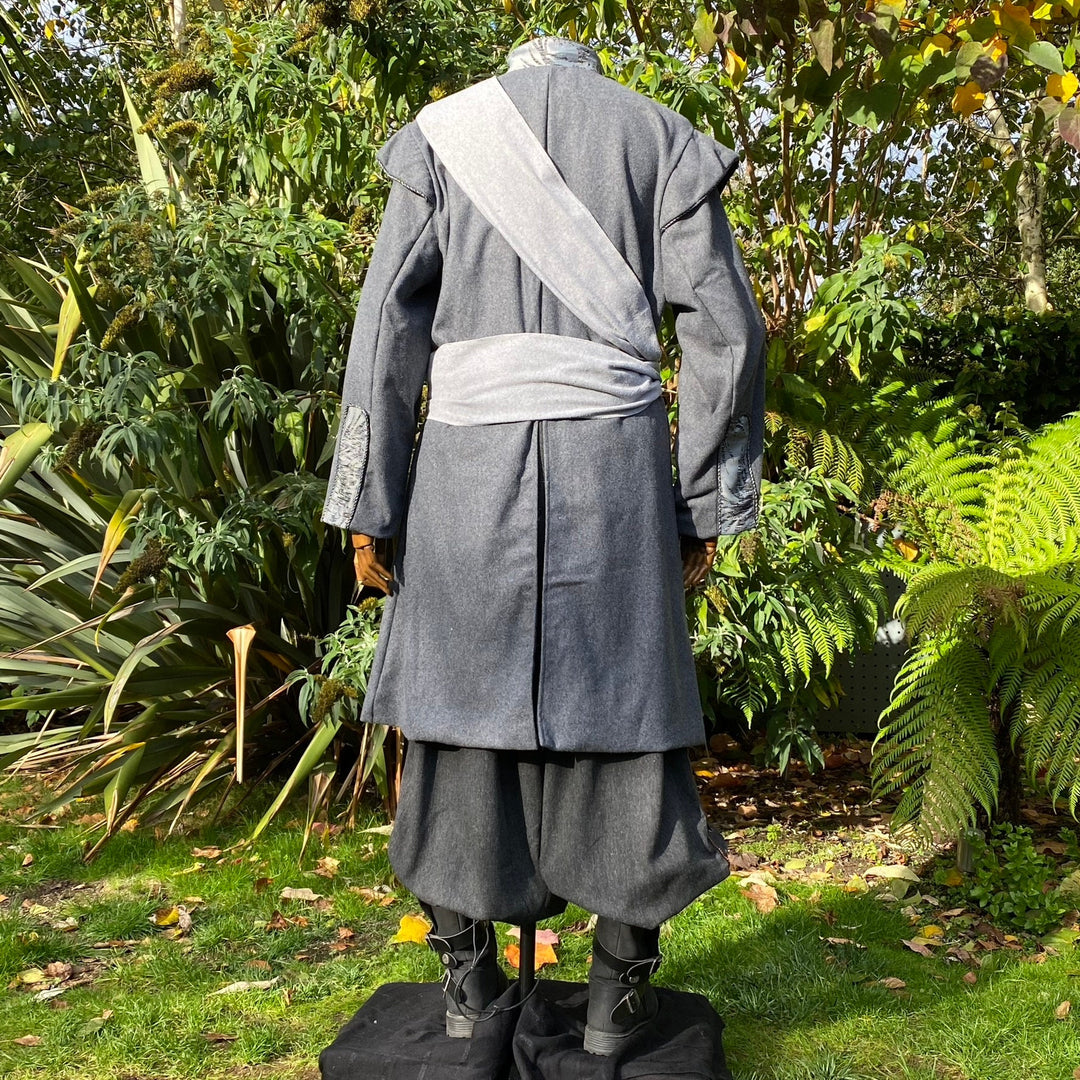 Back view of medieval LARP coat with grey sash.