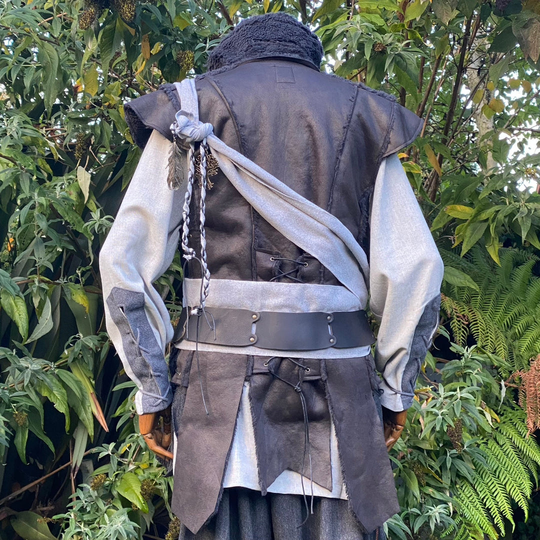 Back view of black faux leather waistcoat with flowing panel design for LARP and fantasy cosplay.