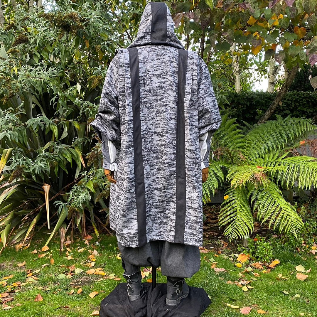 Back view of grey LARP robe and hood set with black trim.