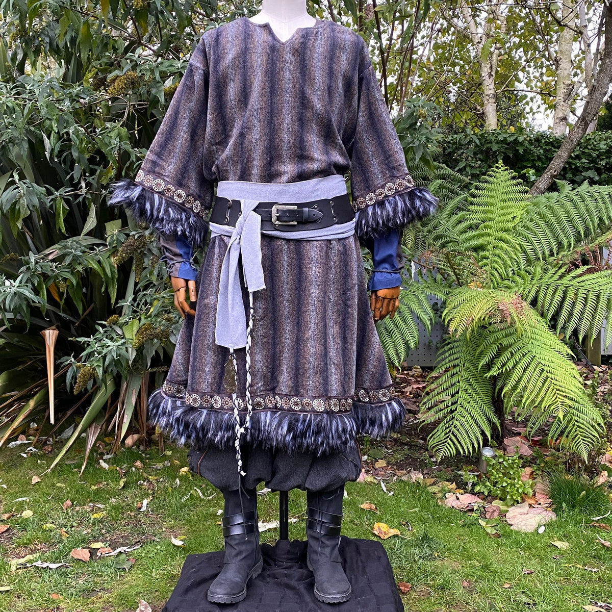 barbarian style tunic in blue and grey with fur accents.