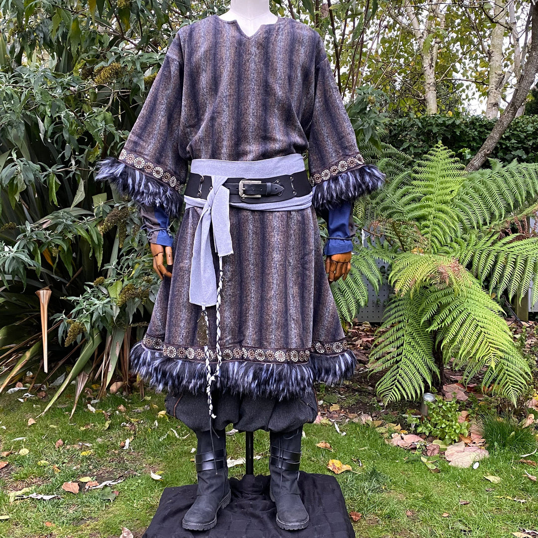 barbarian style tunic in blue and grey with fur accents.