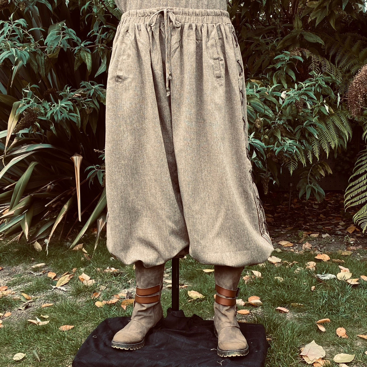 Medieval wool trousers, side view with lace and braiding for LARP events.