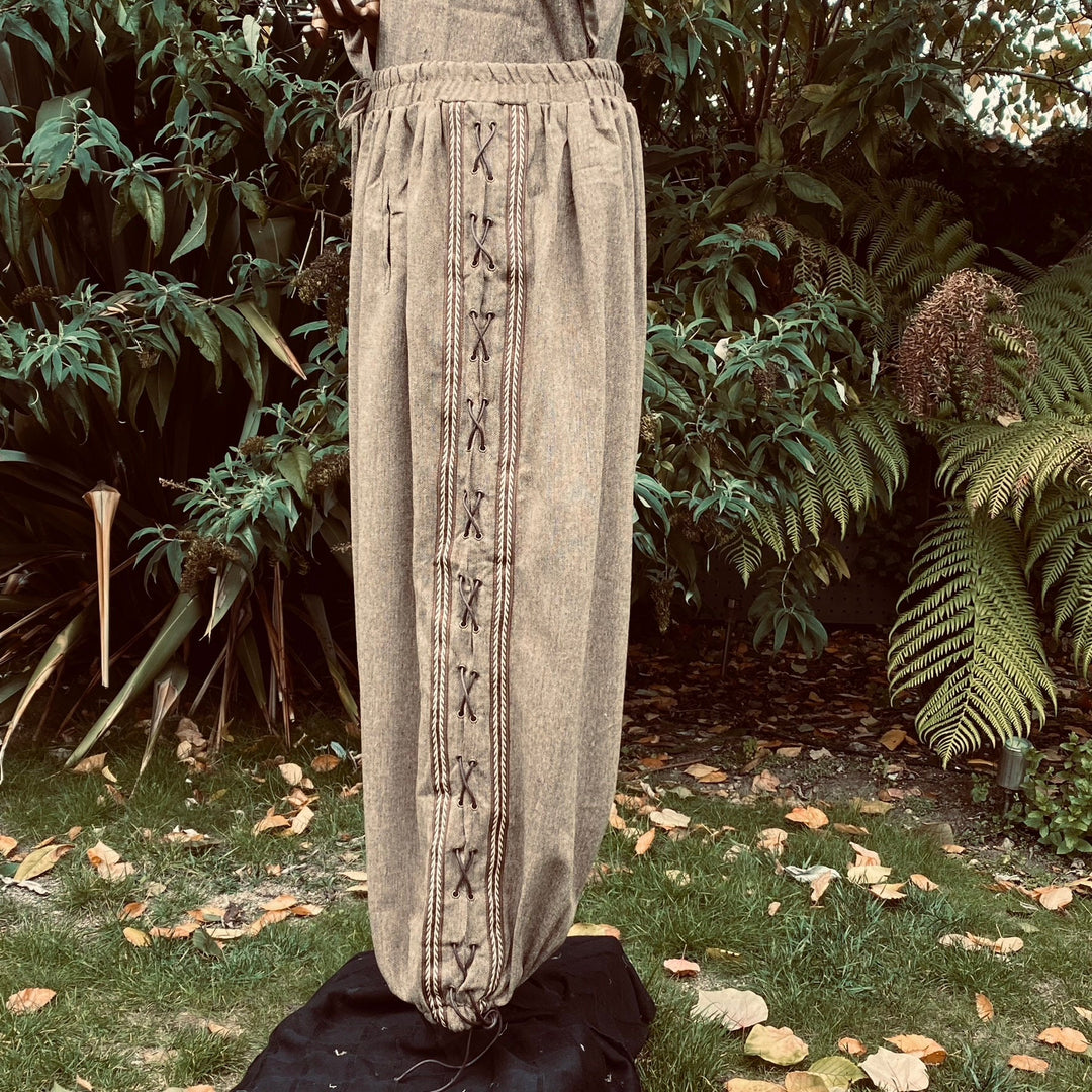Side view of brown wool medieval trousers with detailed lace design for LARP.
