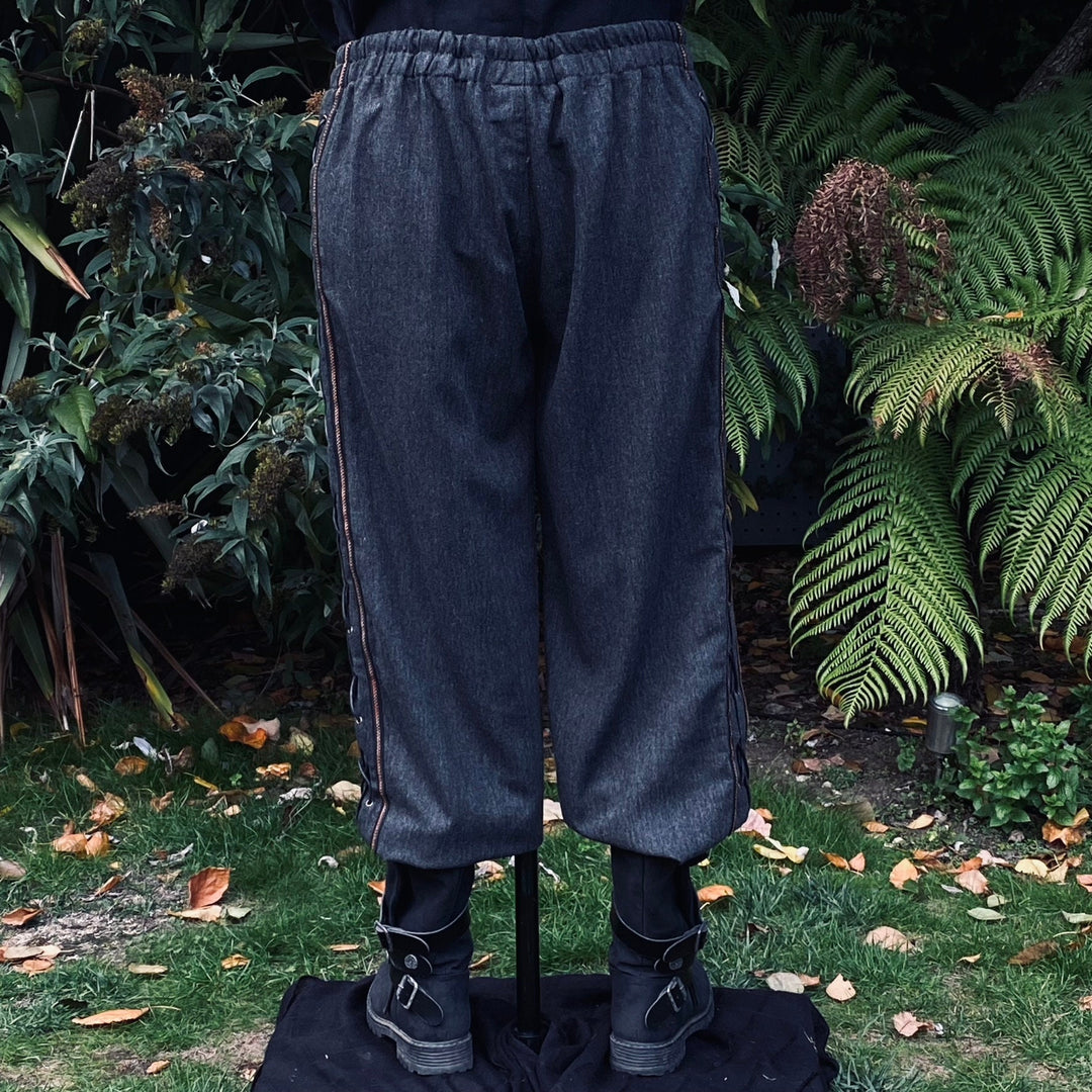 Back view of grey LARP pants showing side laces and.