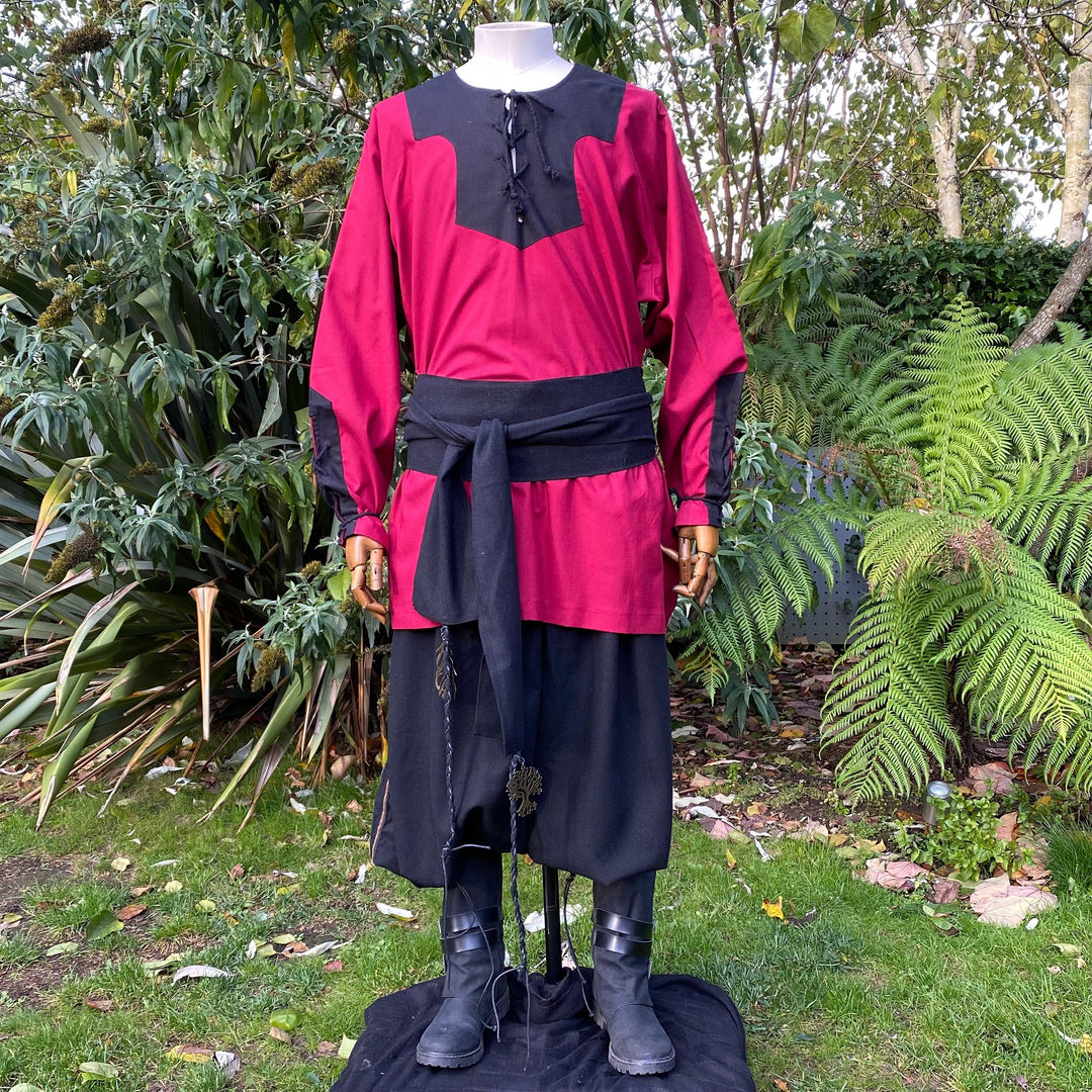 Mannequin in medieval LARP red-black Viking shirt with belt.