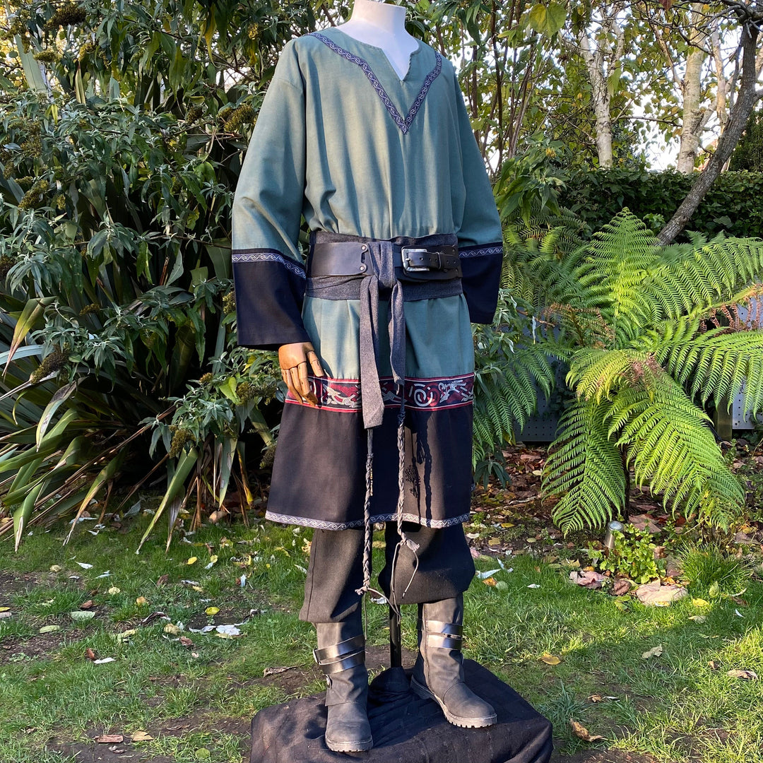 LARP medieval outfit with green tunic, black pants, and sash.