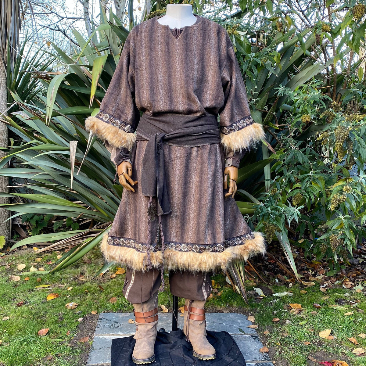 Medieval LARP tunic on mannequin, fur-trim sleeves.